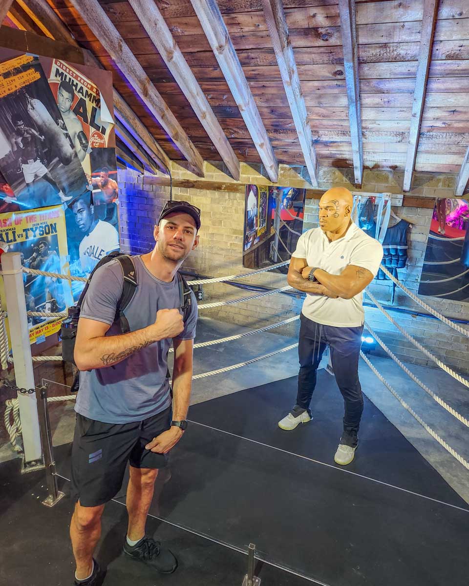 Daniel with a statue of Mike Tyson at Casa Loma, Toronto