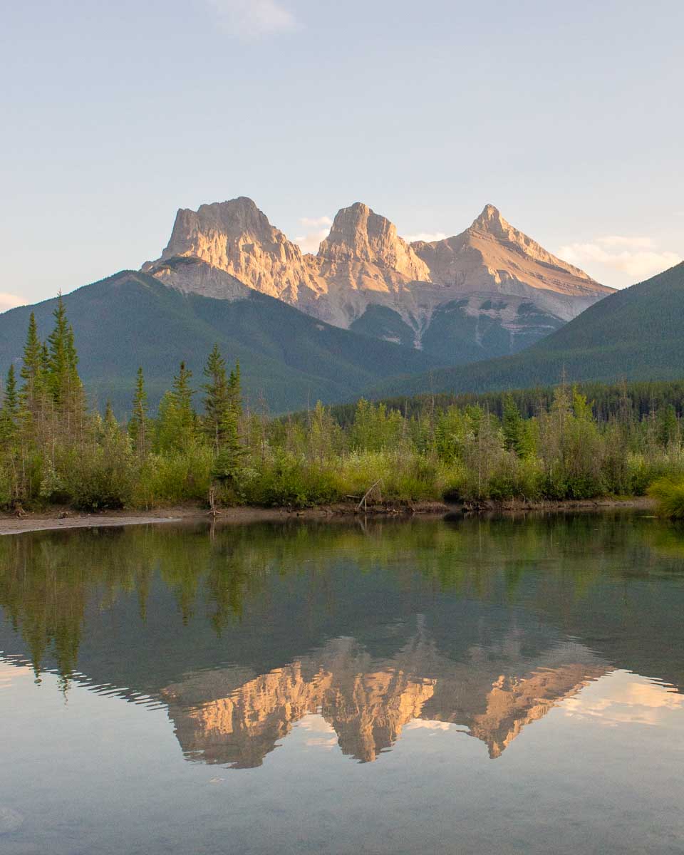 reflections of the Three Sisters in Canmore