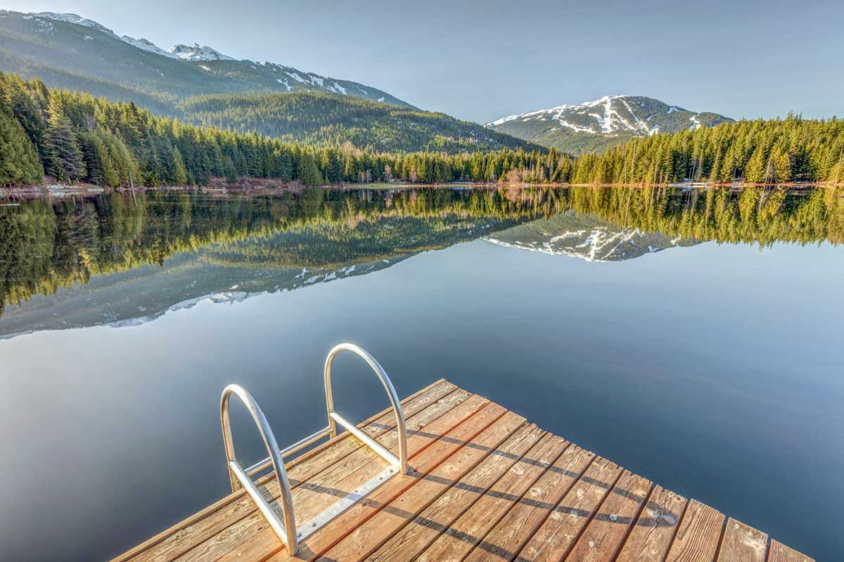 The dock at Lost Lake on a calm day in Whistler
