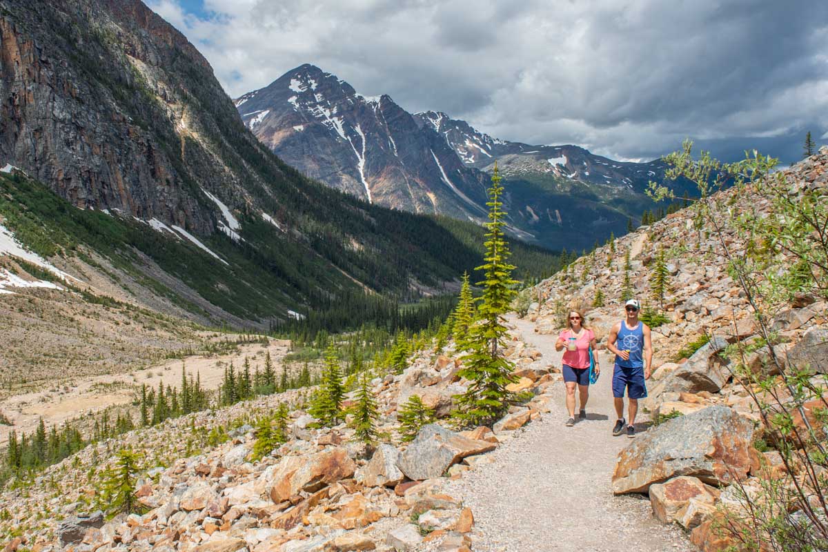 Two people walk along the path to the viewpoint at Mount Edith Cavell, Jasper