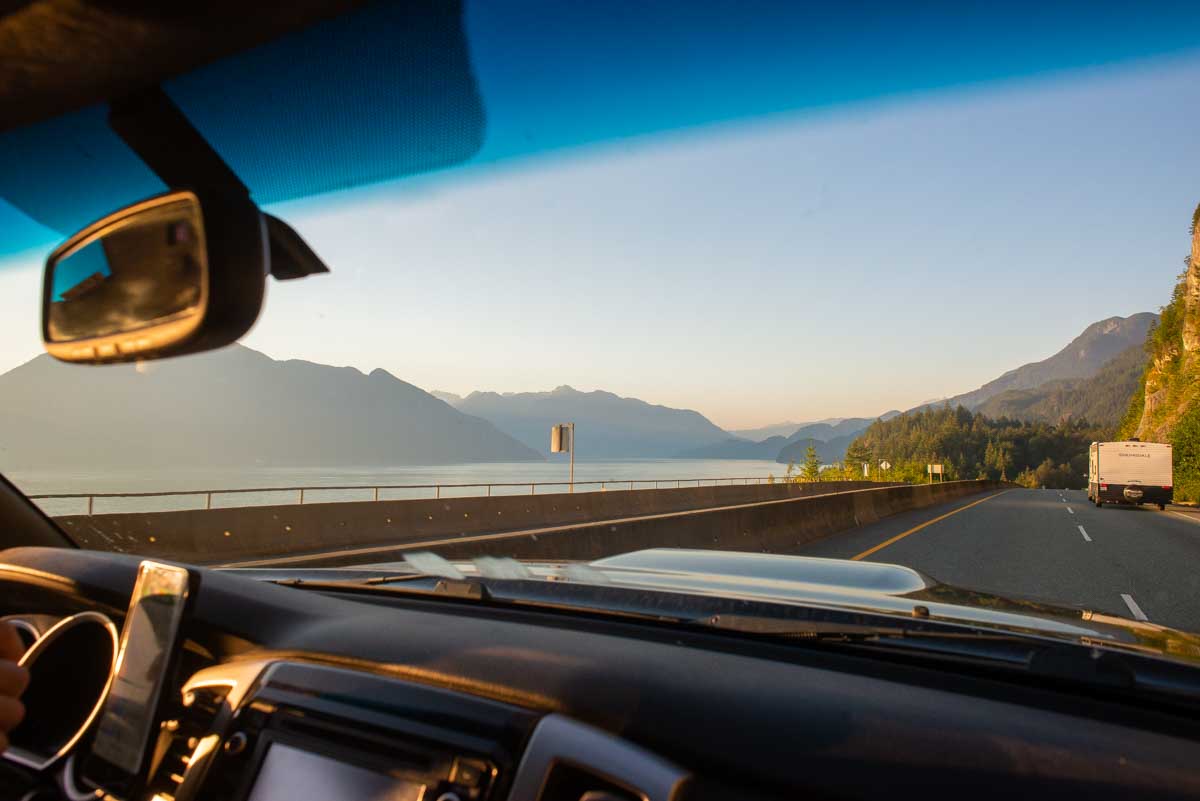 View from inside the car looking out the window while driving the Sea to SKy Highway to Whistler, Canada
