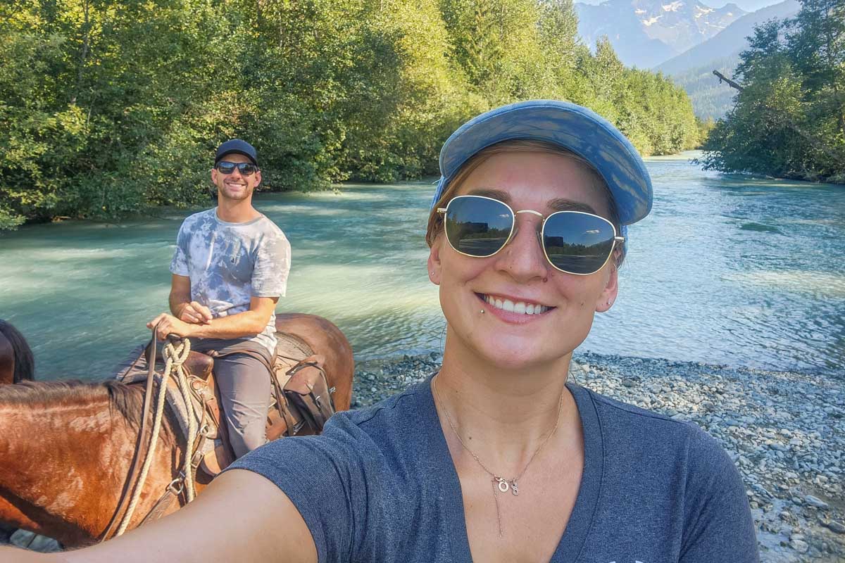 Bailey and Daniel take a selfie in the Spay River in Banff National Park, Canada