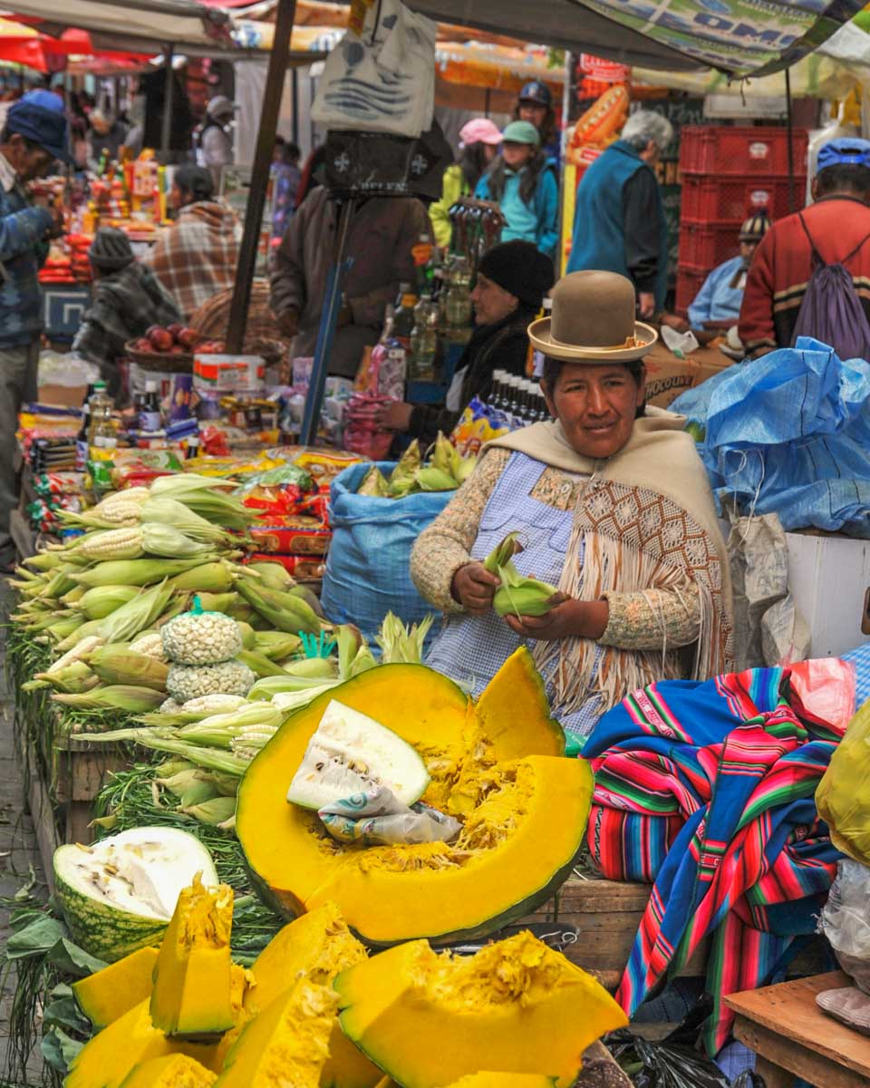A lady at a market during a free walking tour in La Paz, Bolivia