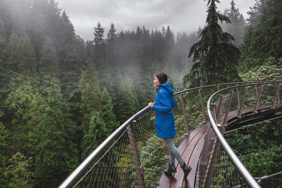 A lady on the Cliff Walk at Capilano Suspension Bridge in Vancouver