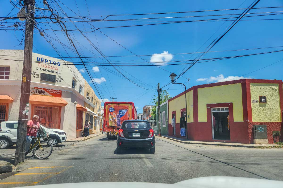 Driving on a cute street in Mexico in a rental car