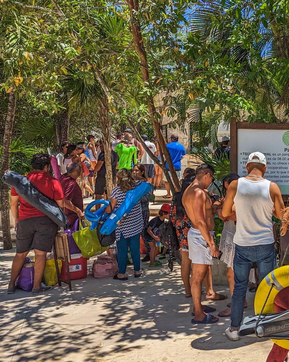 People line up to buy tickets to Akumal Beach