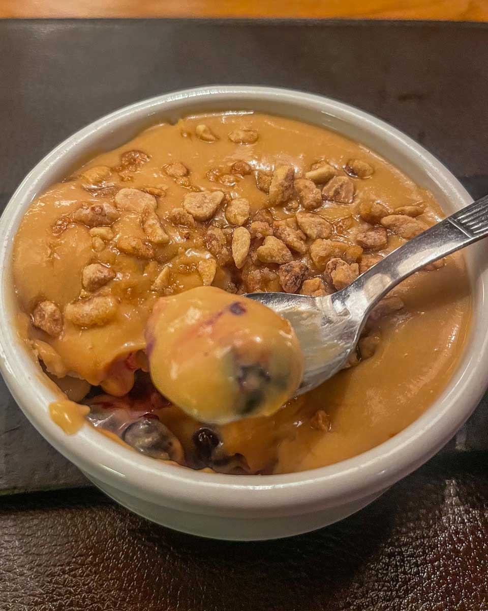 Trying a traditional Argentina dessert at the Argentine Experience in Buenos Aires