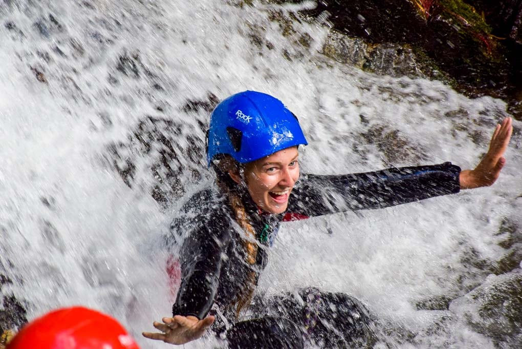 Bailey smiling in a rivier canyoning