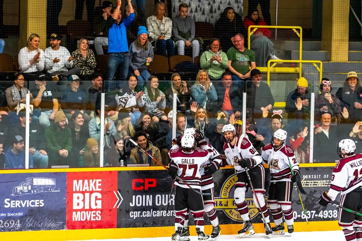 The Revelstoke Grizzlies hockey team celebrates on the ice