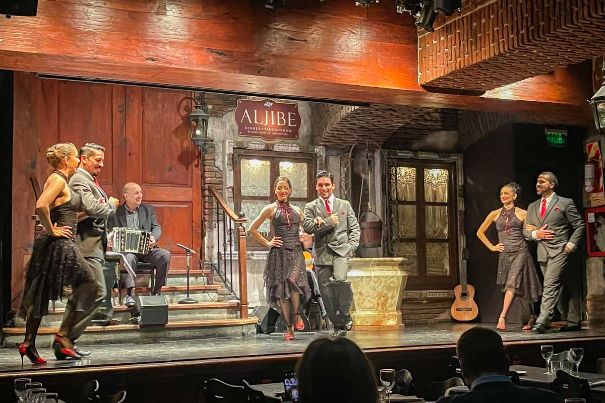 six dancers on stage during a tango show in Buenos Aires, Argentina