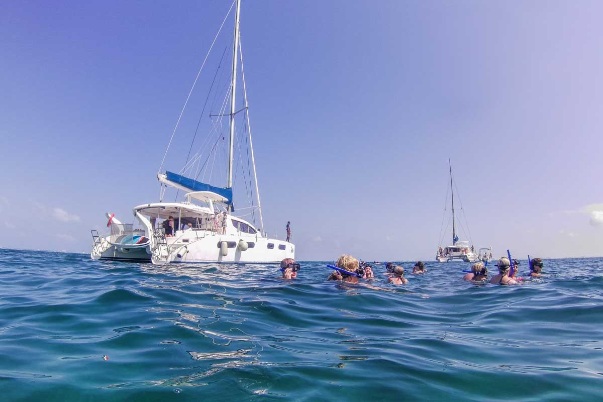 A boat drops a group of snorkelers off in Cancun, Mexico