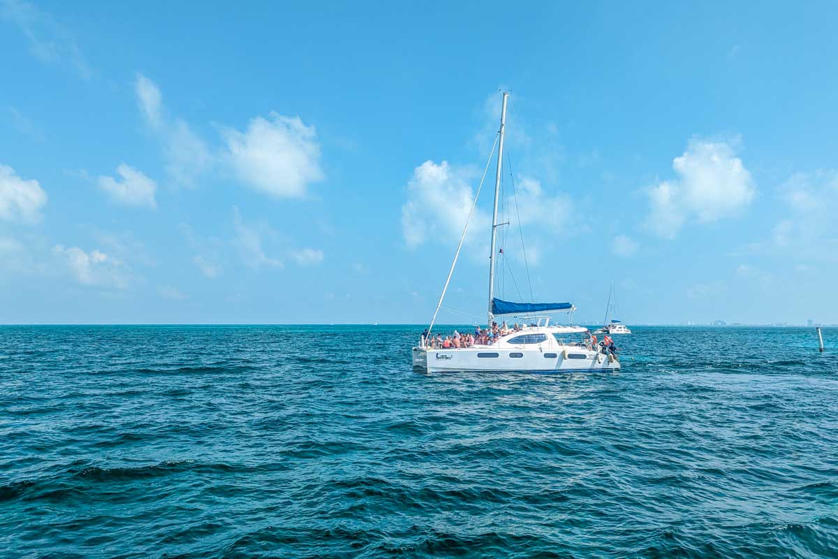 A catamaran in the beautiful waters between Isla Mujeres and Cancun