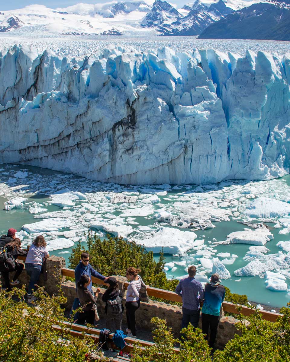 A group of tourists on the viewing platform of the Perito Moreno Glacier