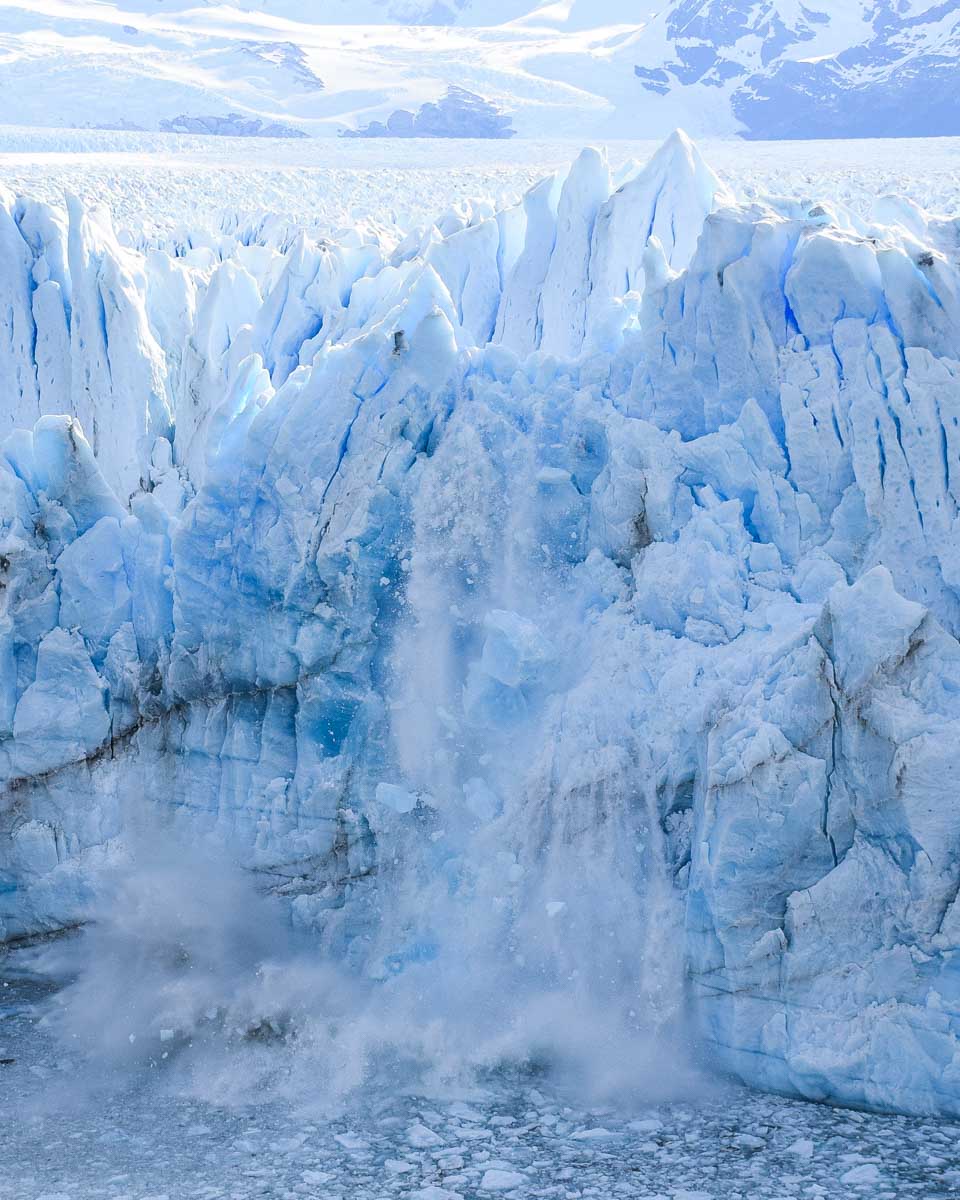 A huge chunk of ice hits the water after falling from Perito Moreno Glacier in Argentina