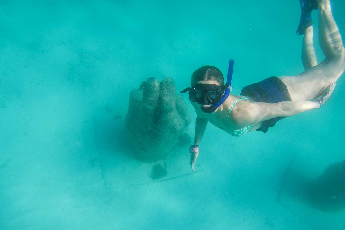 Bailey dives down around a manmade coral in Cancun, Mexico while snorkeling