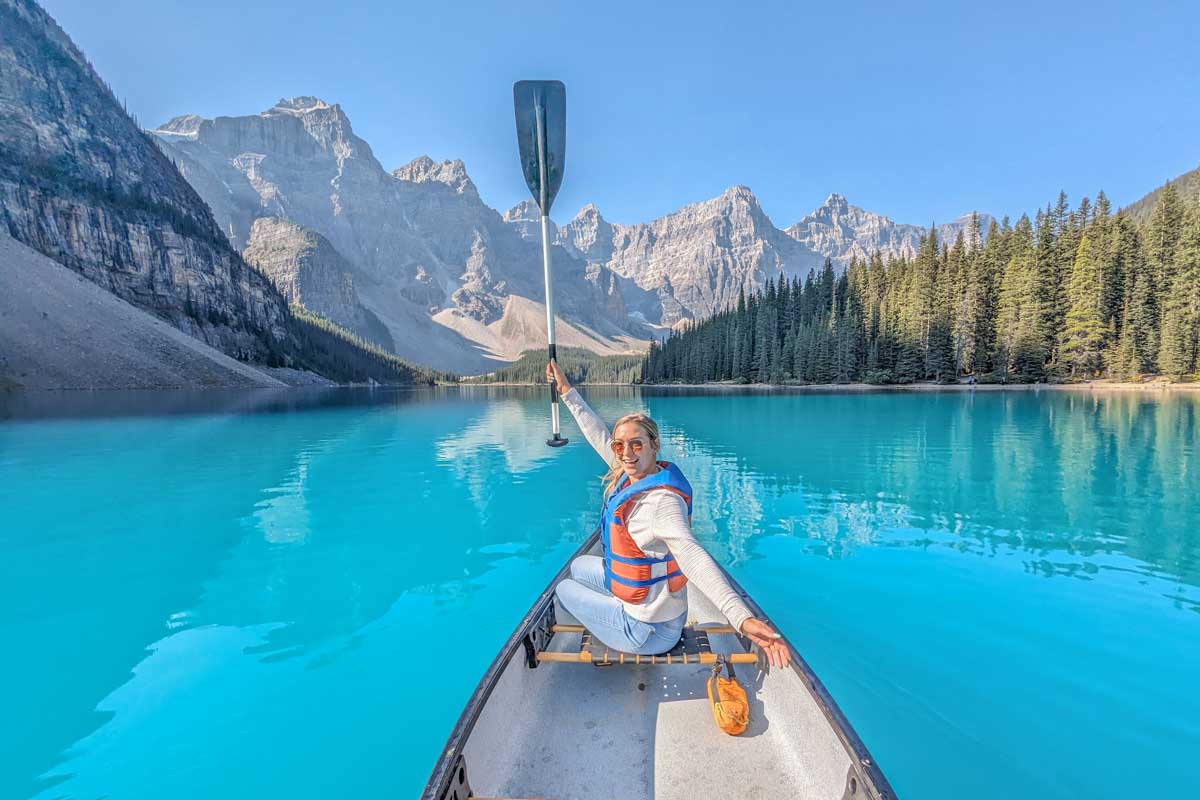 Bailey poses for a photo while canoeing in Moraine Lake, Banff