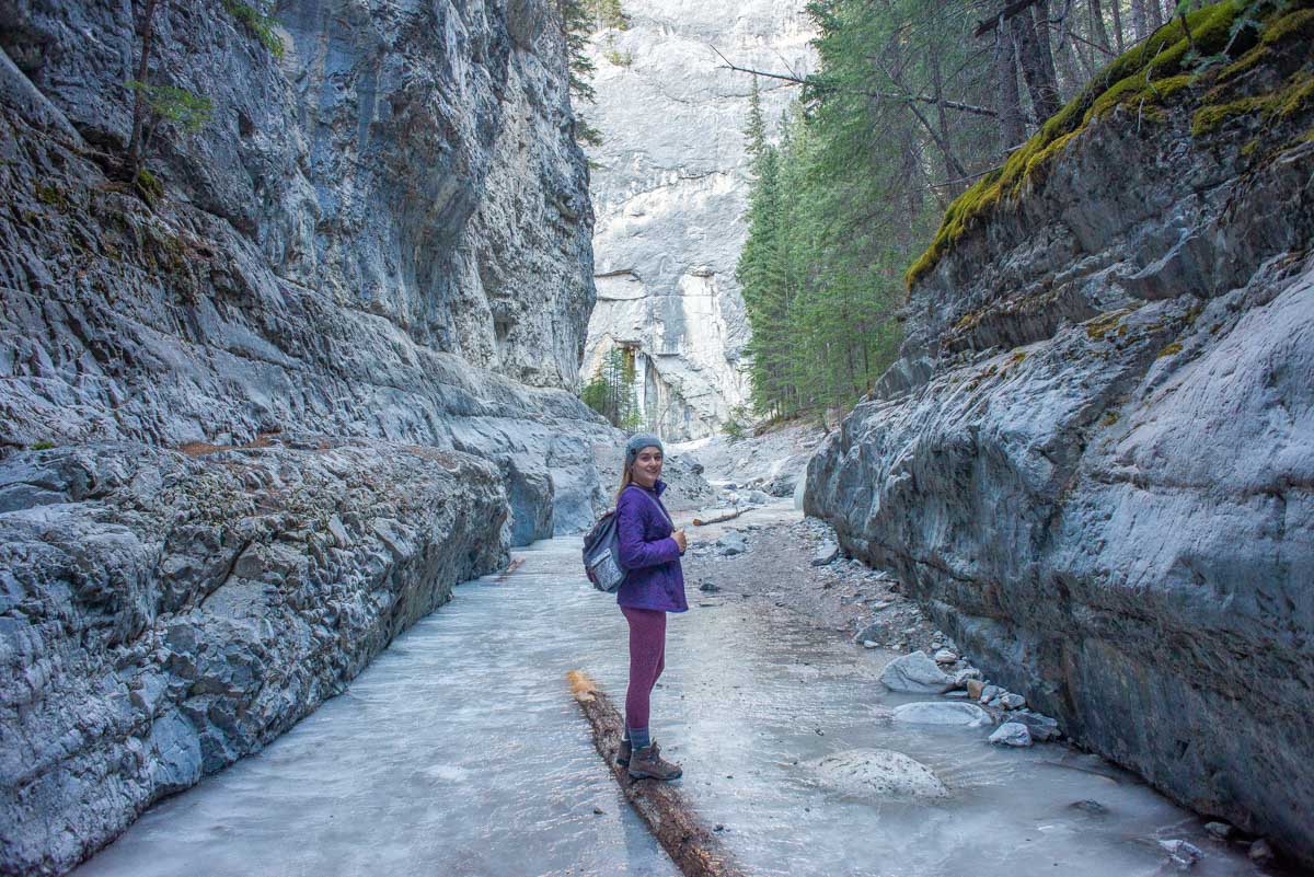 Bailey walks along a sheet of ice in the Grotto Canyon