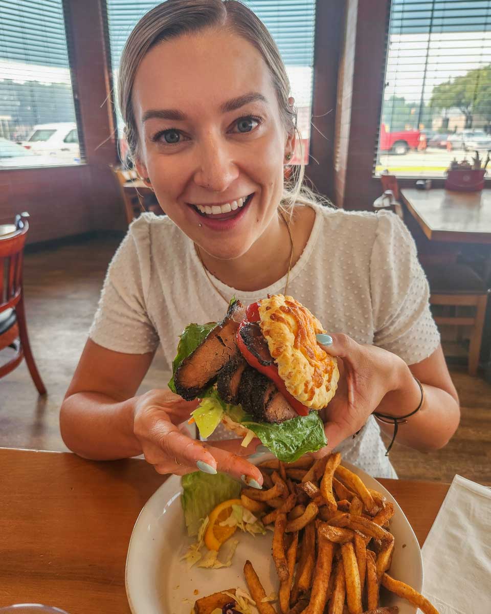 Bailey with a sandwich at Station BBQ Smokehouse in Vernon, BC