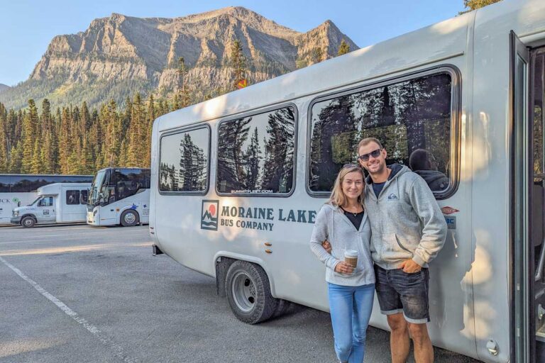 Daniel and Bailey pose for a photo with the Moraine Lake shuttle