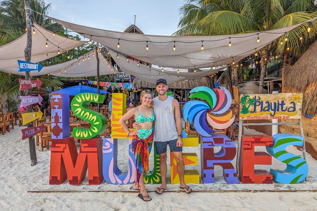 Daniel and Bailey take a photo with the Isla Mujeres Sign, Mexico