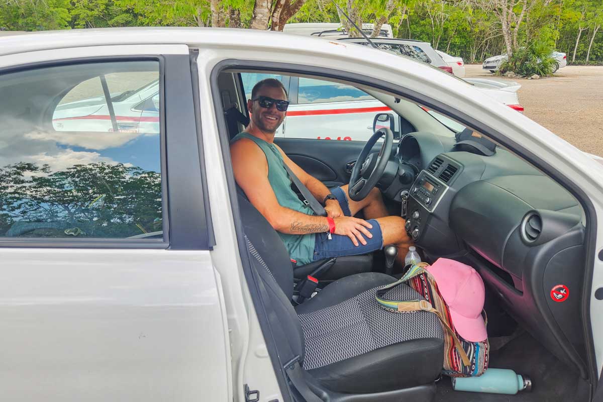 Daniel sits in his rental car in Argentina