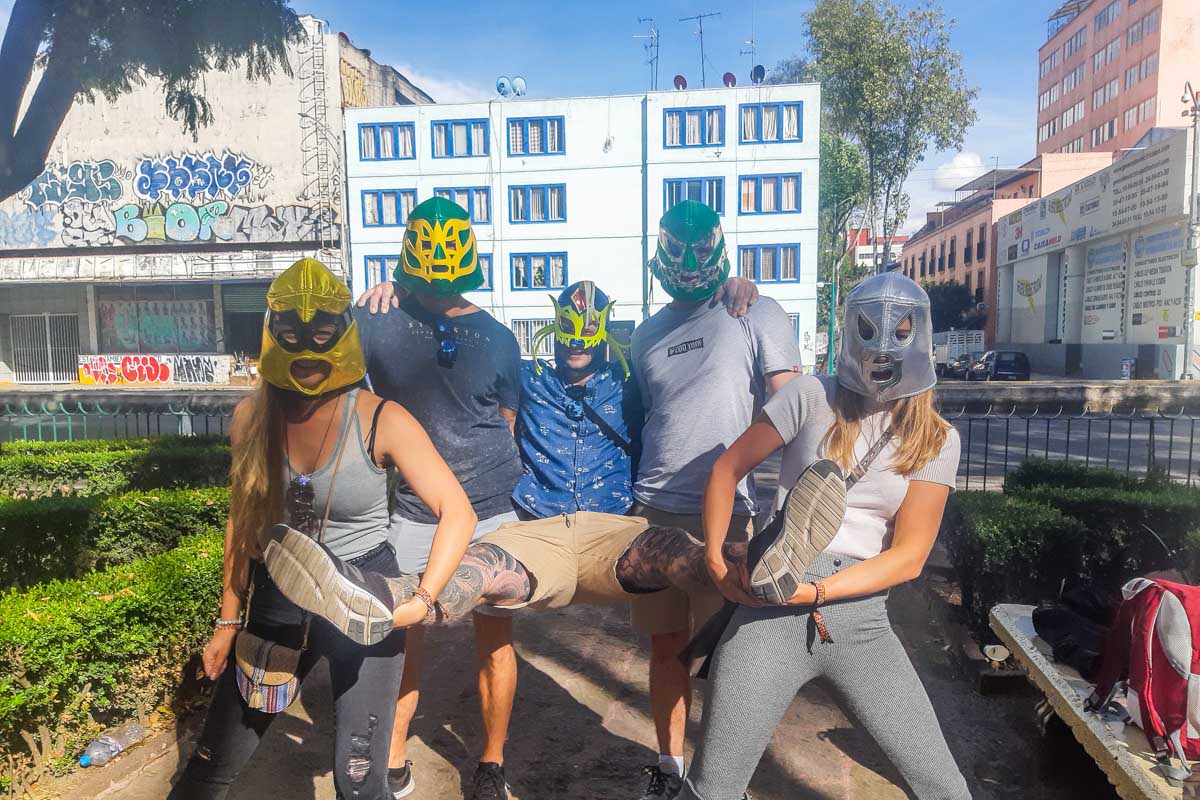 Our group in Lucha Libre Masks pose for a wrestling photo before our Lucha Libre show in Mexico City