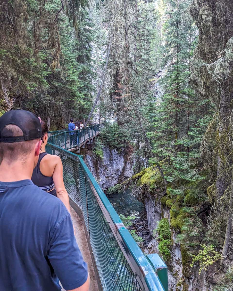 People walk along the boardwalk at Johnston Canyon in Banff National Park