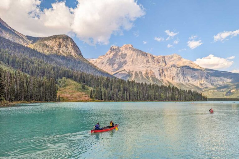 Two people canoe at Emerald Lake in Yoho National Park