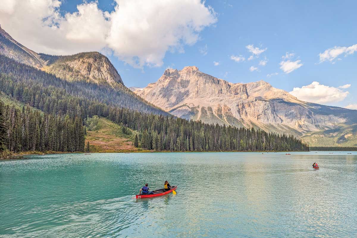 Two people canoe at Emerald Lake in Yoho National Park