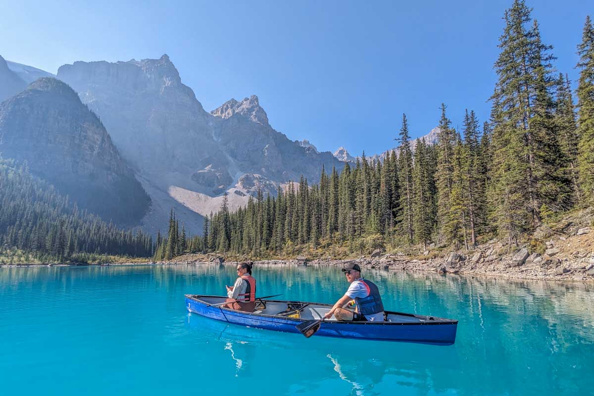 Two people canoe on Moraine Lake in Banff