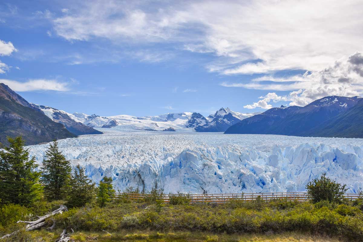 Wide shot of the Perito Moreno Glacier with a mountain backdrop