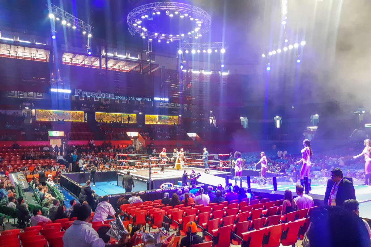 Wrestlers walk to the ring at the start of a Lucha Libre show in Mexico City