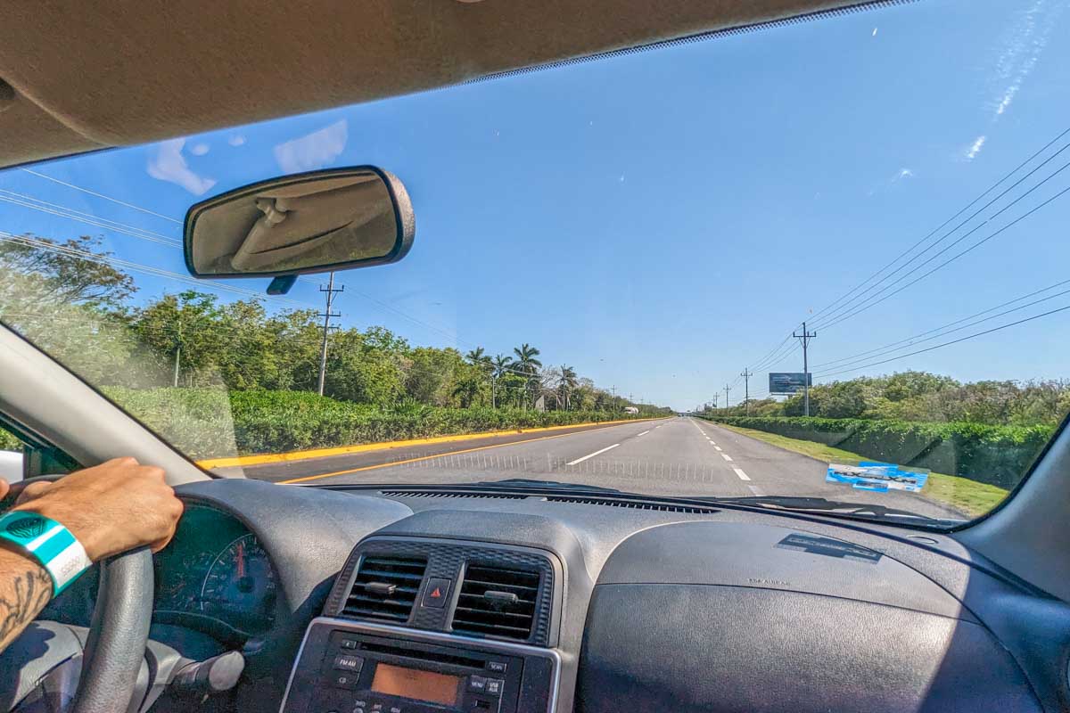 A photo out the windscreen while driving a rental car in Mexico