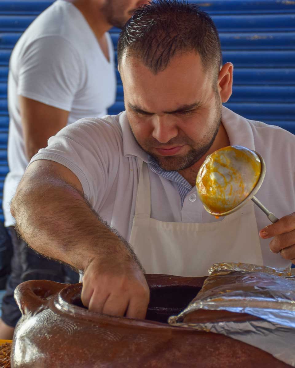 A taco chef makes tacos in Cancun, Mexico