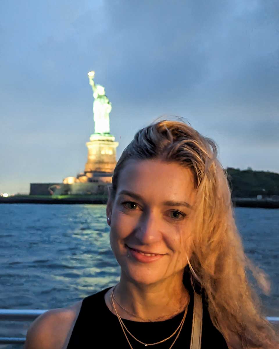 Bailey poses for a photo with the Statue of Liberty on our cruise in NYC
