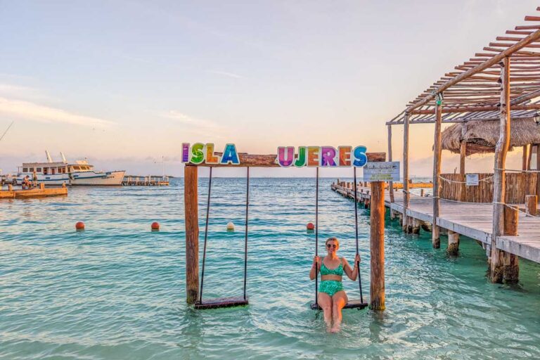 Bailey relaxes on a swing on Isla Mujeres while the catamaran comes to pick us up