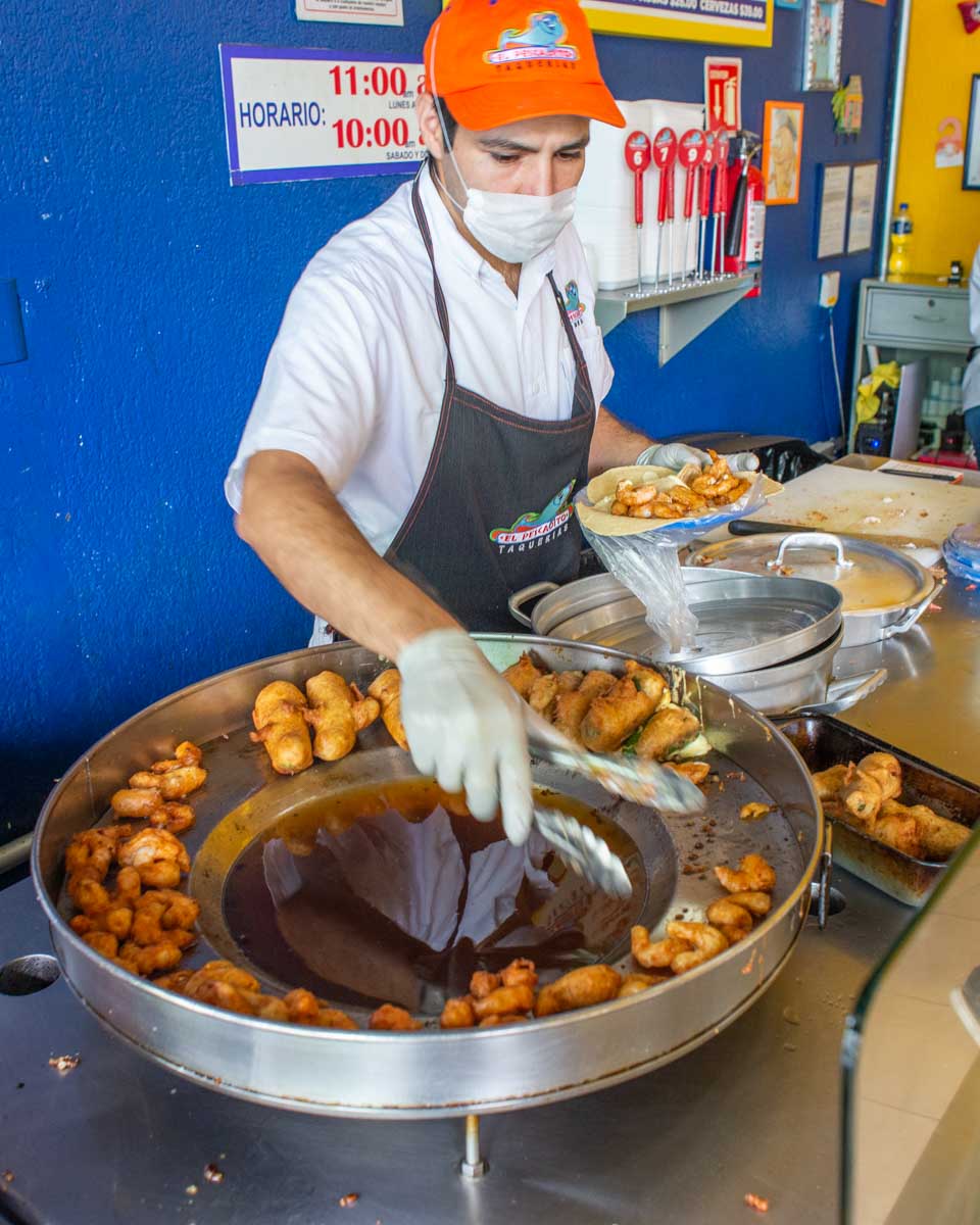 Seafood taco restaurant prepares tacos