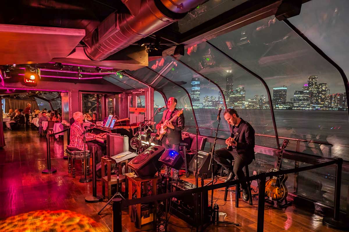 The band on the Bateaux New York Premier Dinner Cruise with views of the city in the background