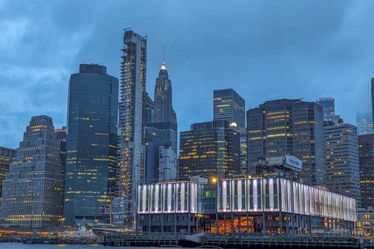 The city of New York at night as seen from a New York City dinner cruise