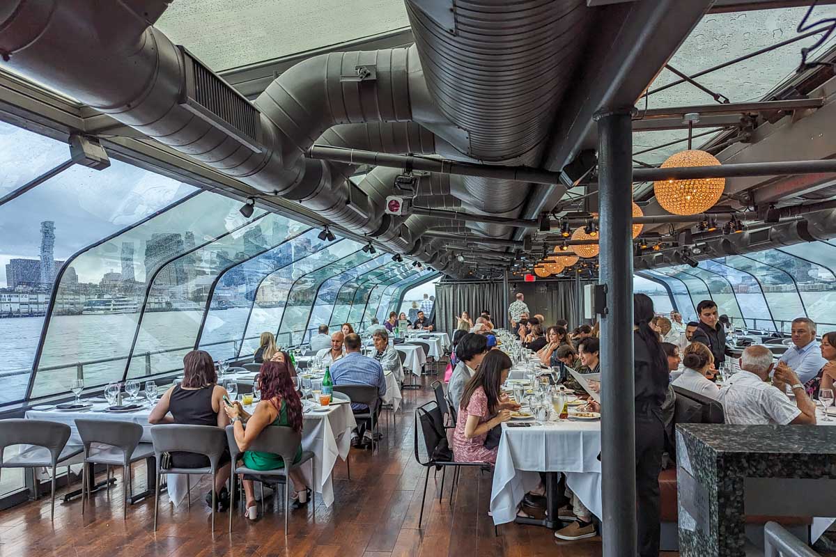 The dining hall on the Bateaux New York Premier Dinner Cruise
