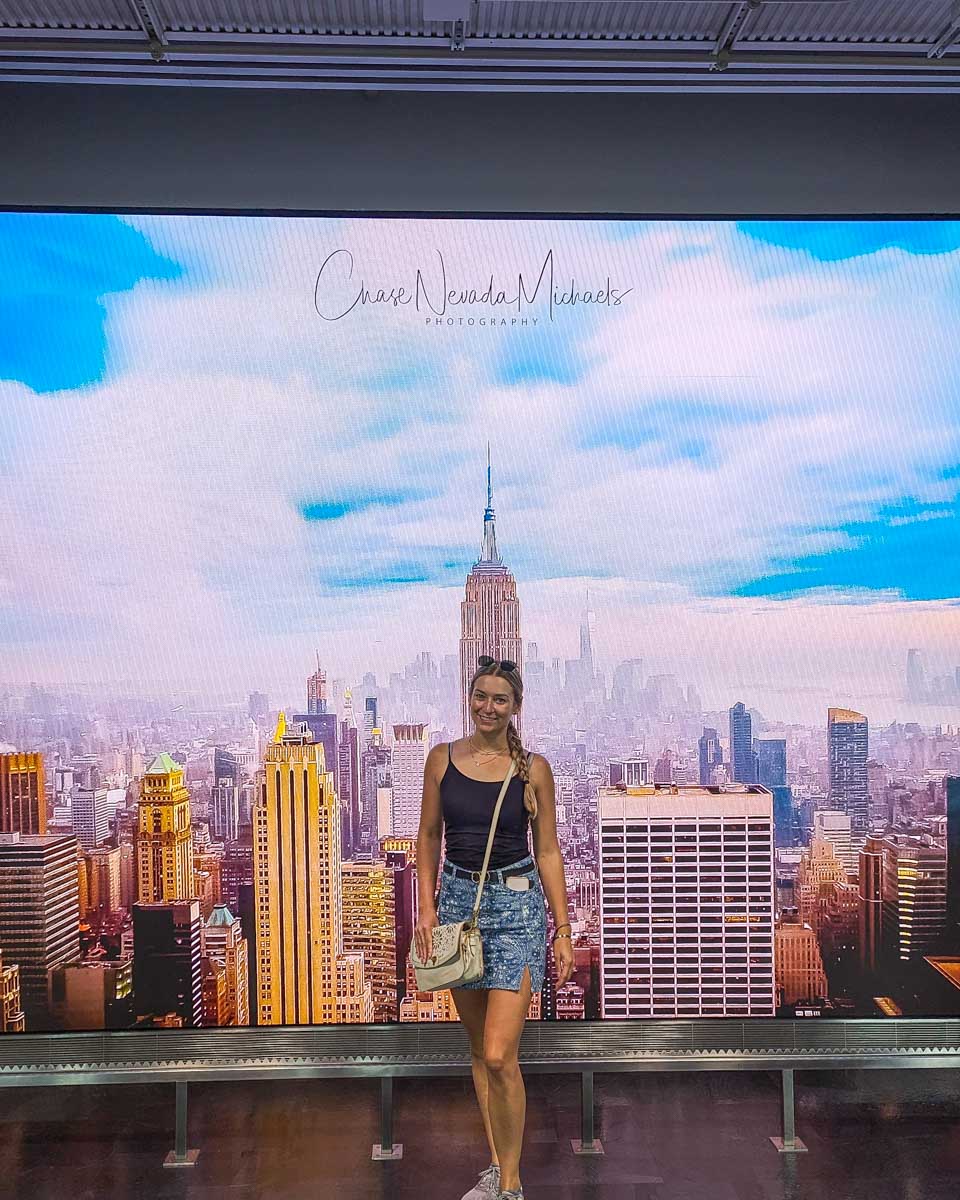 Bailey poses for a photo at a display on the 80th floor of the Empire State Building in NYC