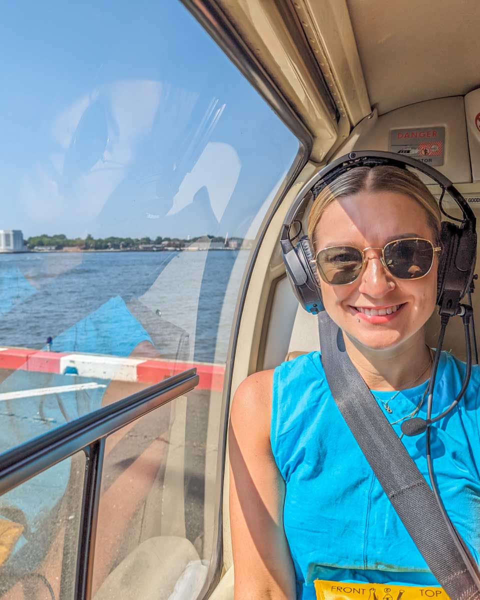 Bailey smiles at the camera in a Helicopter in New York City