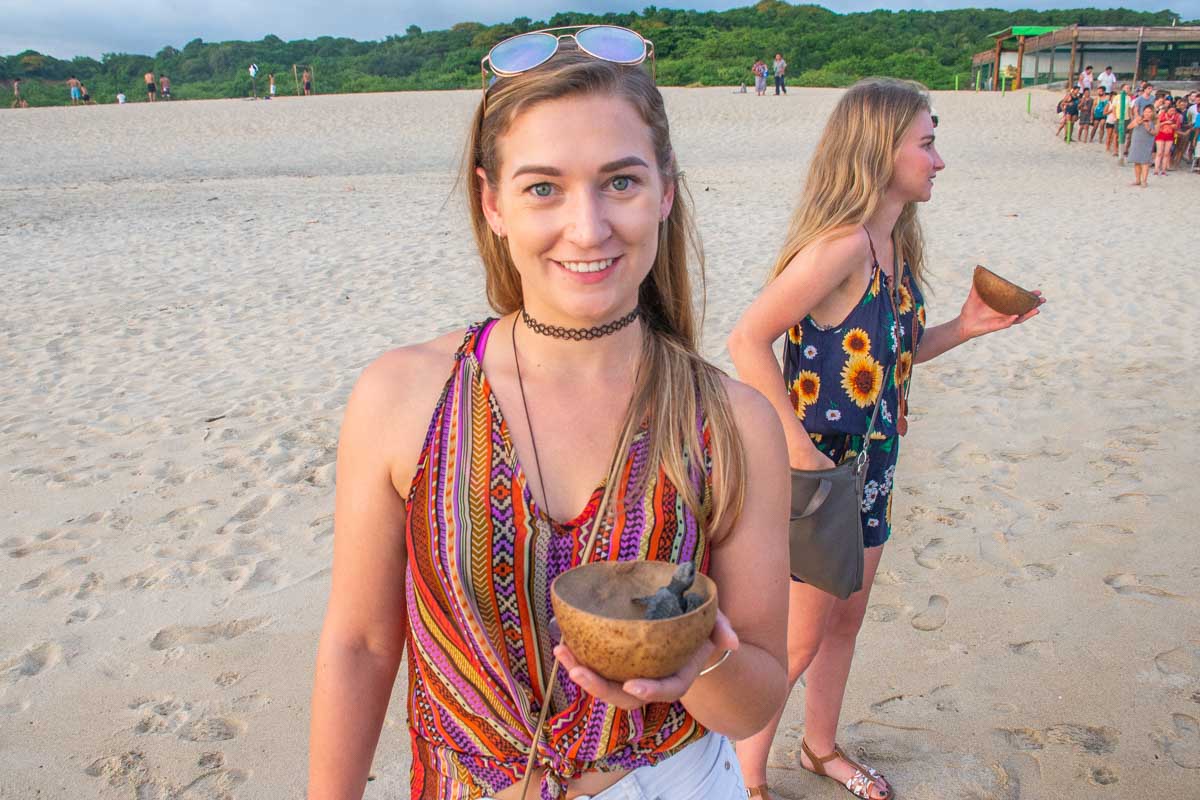 Bailey with a baby turtle in Oaxaca on a tour