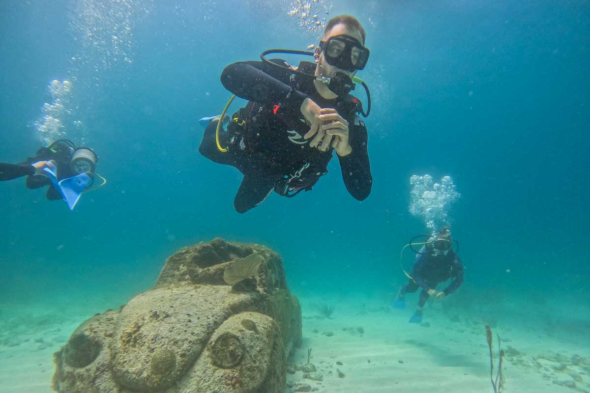 Daniel and Bailey scuba at MUSA in Puerto Morelos, Mexico