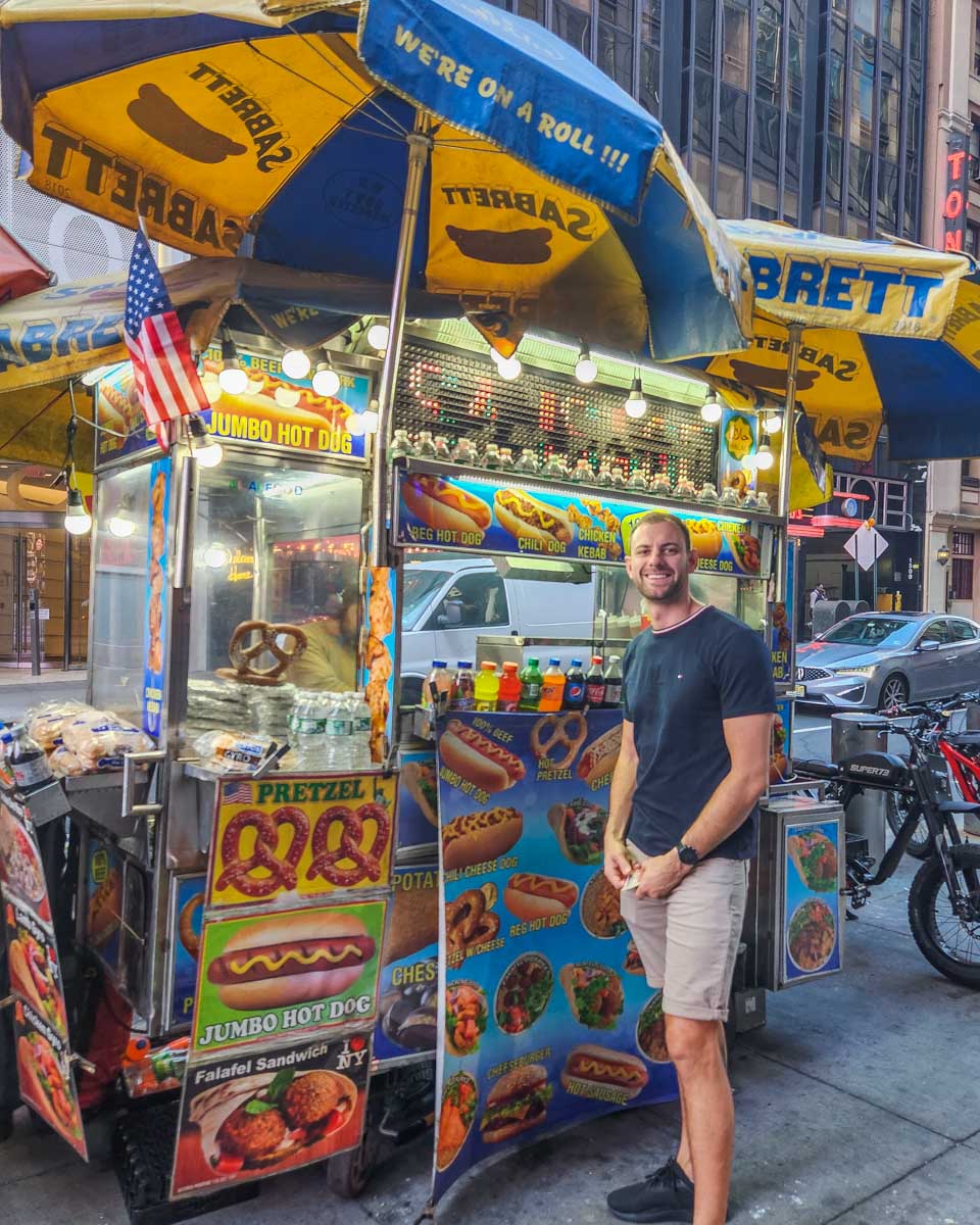 Daniel at a hot dog stand in New York City