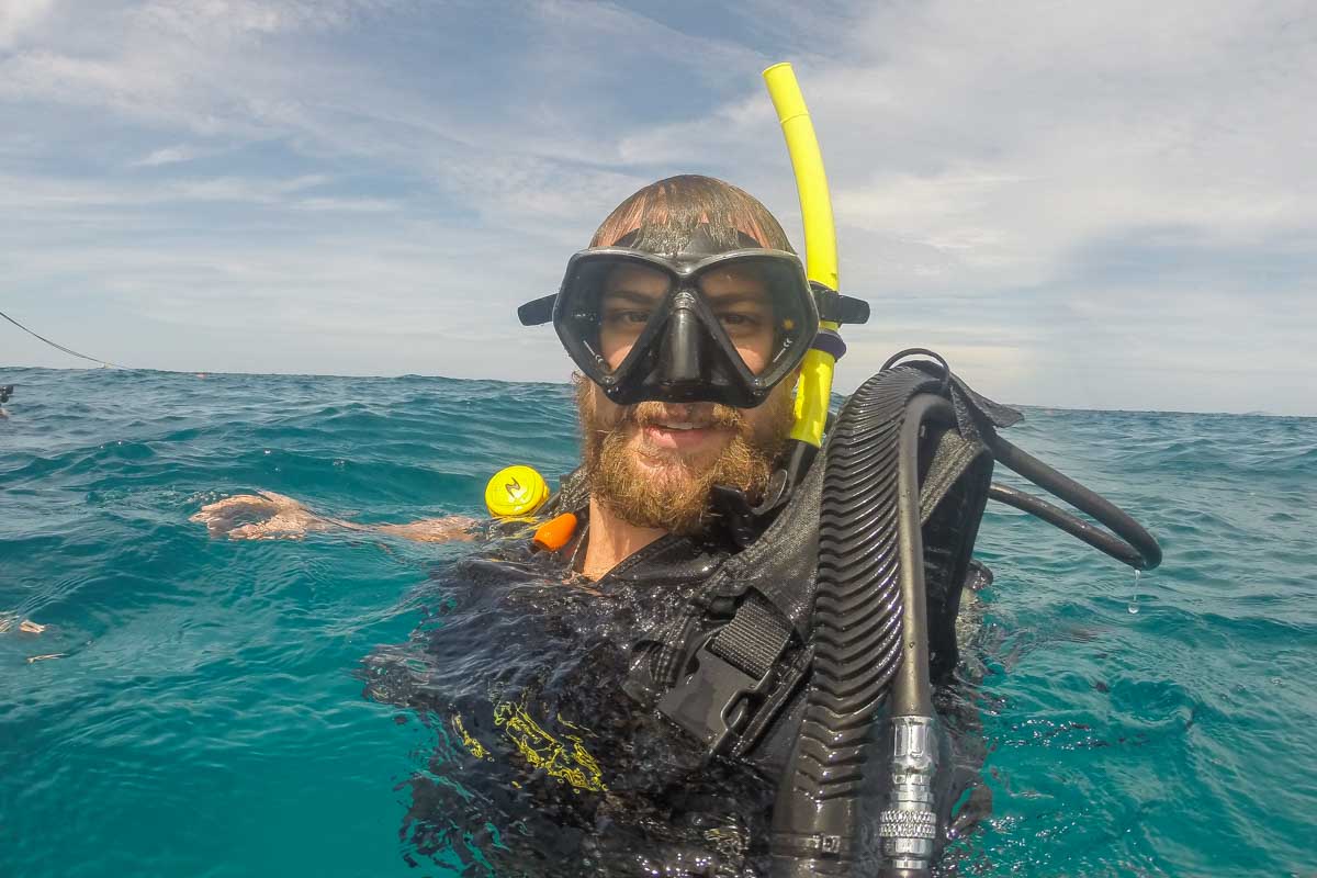 Daniel surfaces while scuba diving in Puerto Vallarta, Mexico