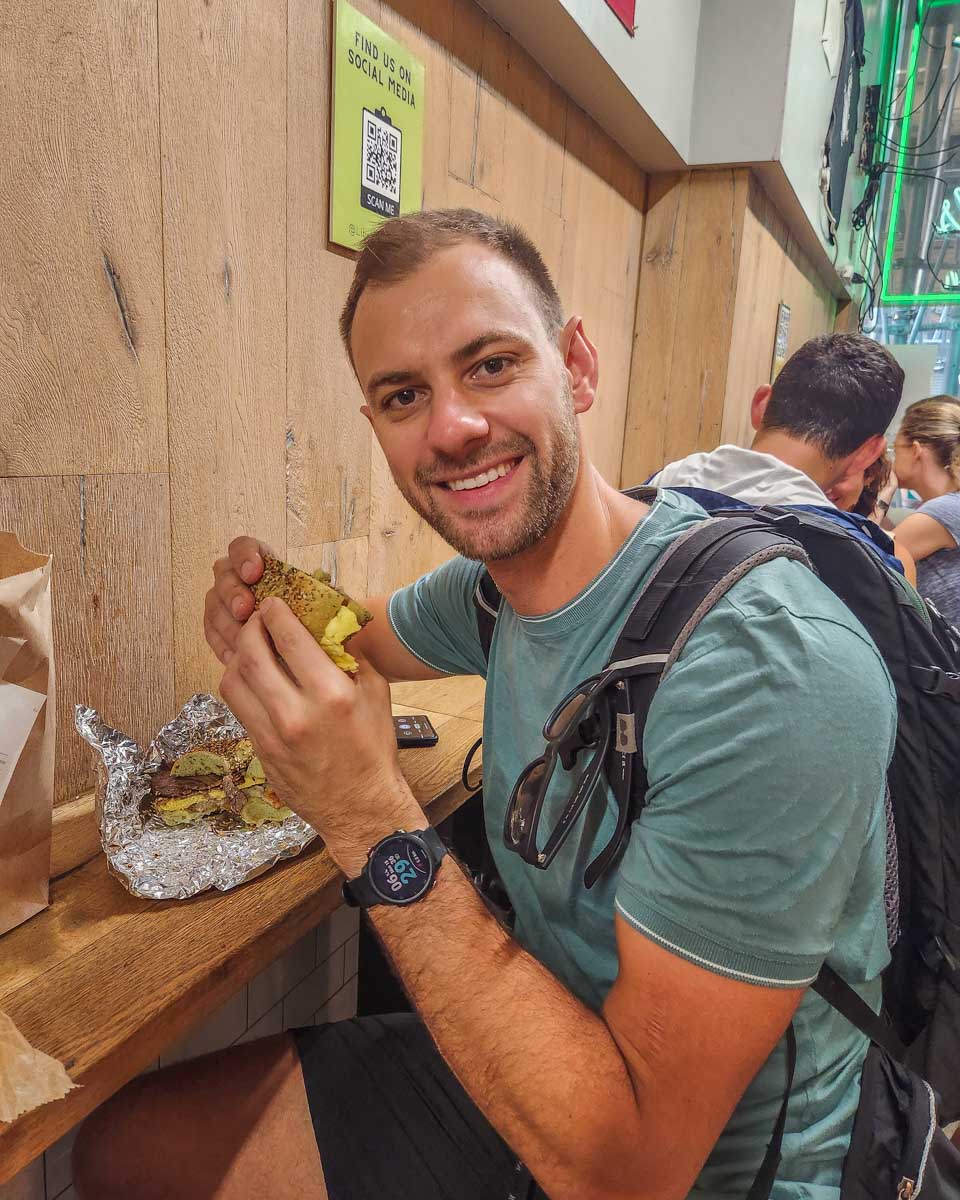 Daniel with a bagel from Liberty Bagels in New York City