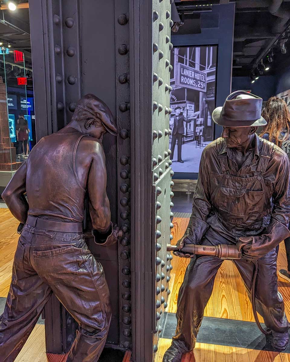 Statue of men working at the Empire State Building museum
