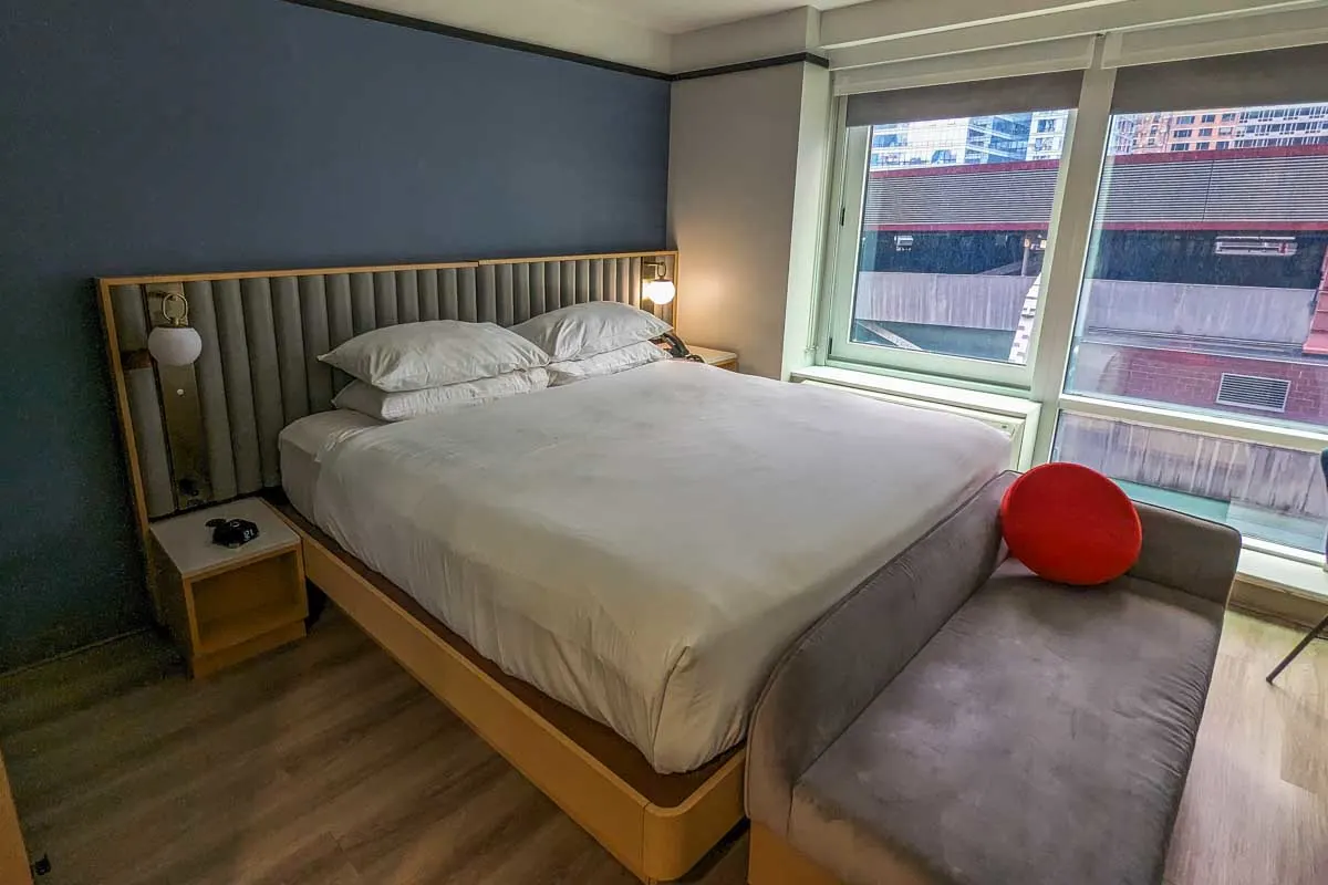 the bed inside TBA Times square hotel in a modern room