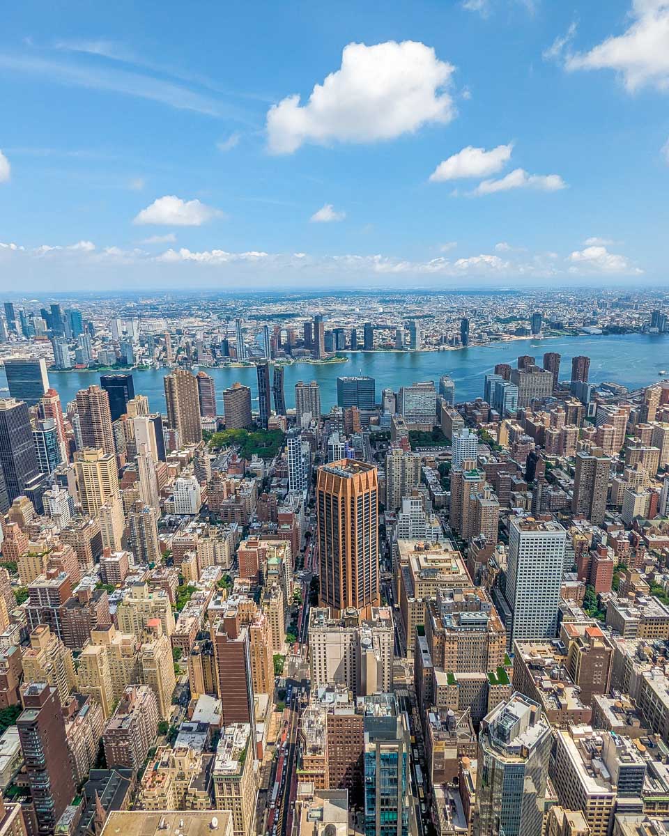 The Hudson river sits behind the city as seen from the Empire State Building in NYC